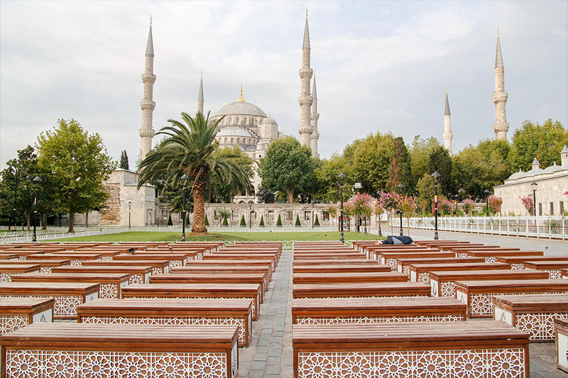 Distant view of the Blue Mosque with its silhouette standing out in the Istanbul skyline.