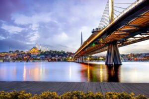 Sunset view of Golden Horn with metro bridge and Suleymaniye Mosque