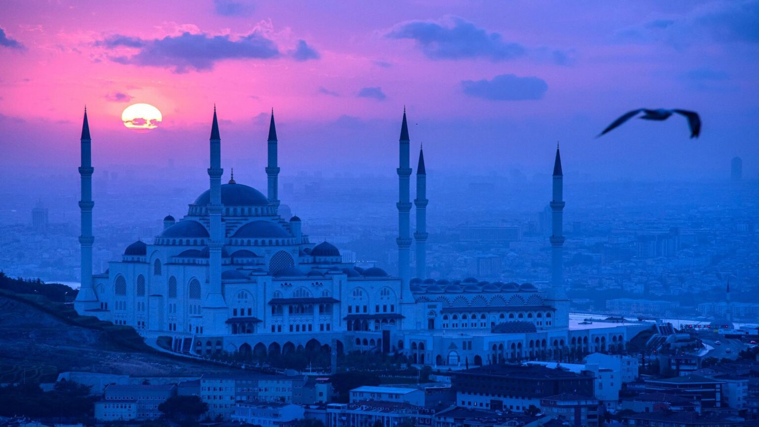 Dreamy sunset view of Çamlıca Mosque in purple tones