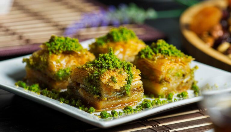 Slices of golden, flaky Turkish baklava with pistachios