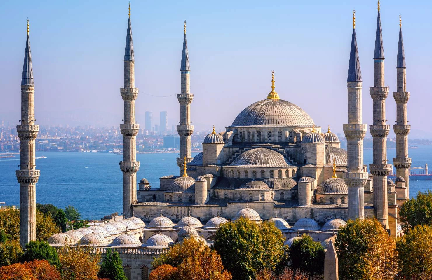 Blue Mosque dome and minaret with Bosphorus Strait in the background, Istanbul.