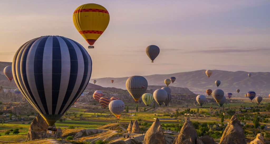 Hot air balloons soaring above the fairy chimneys of Cappadocia