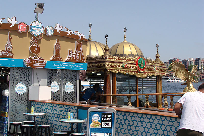 Grilled fish sandwich boats docked at Eminonu ferry terminal