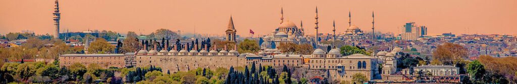 Wide-angle view of Topkapi Palace, Hagia Sophia, and Beyazit Tower in sunset