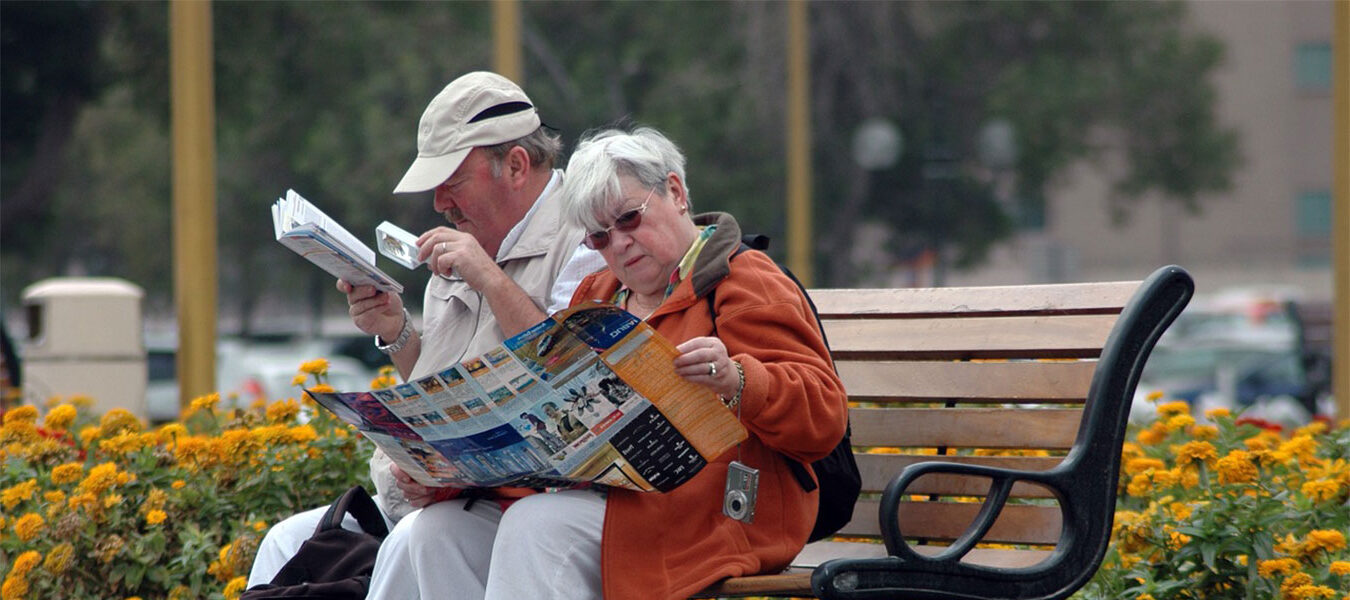 Two tourists studying a map with a local guide in Istanbul