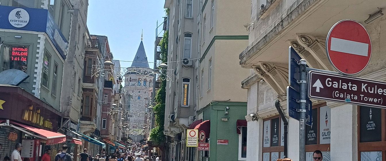 Narrow cobblestone streets leading up to Galata Tower in Istanbul