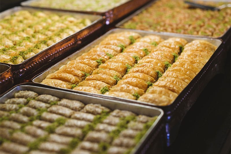 Traditional Turkish baklava layers with pistachios for dessert page content