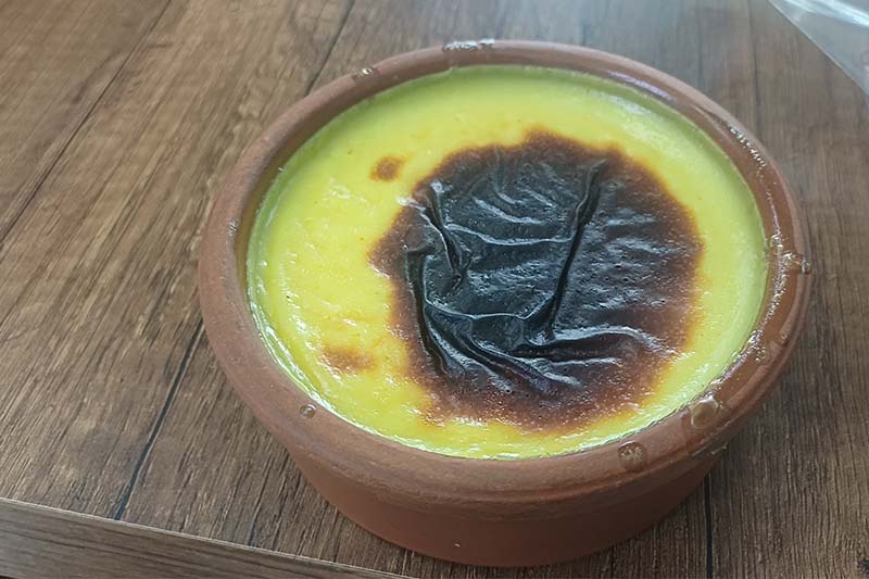 Traditional Turkish sütlaç rice pudding in clay bowls