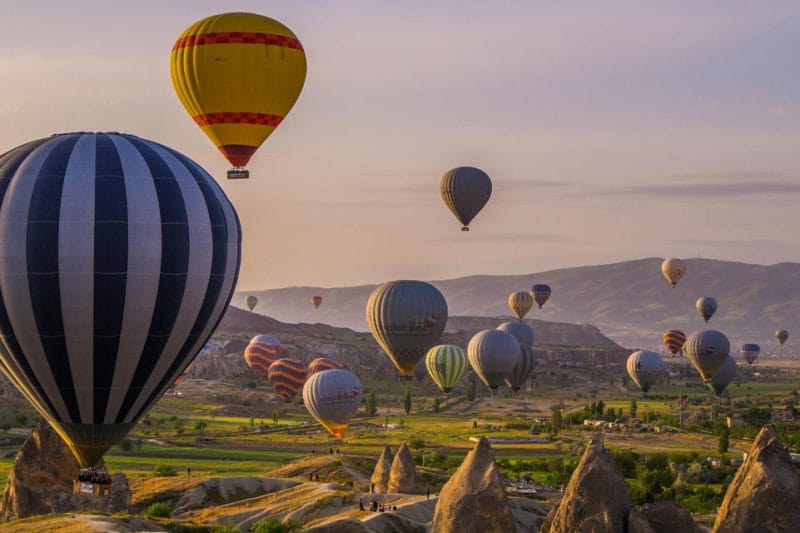 Hot air balloons soaring above the fairy chimneys of Cappadocia