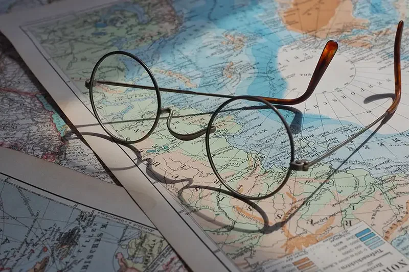Glasses on a world map representing Istanbul Tourism Industry Fair