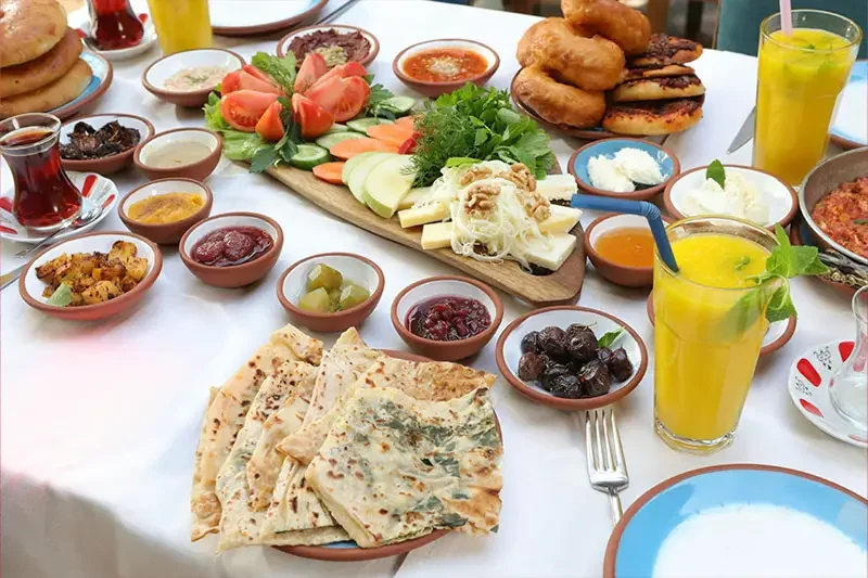 Traditional Turkish breakfast with olives, cheese, tomatoes, and bread